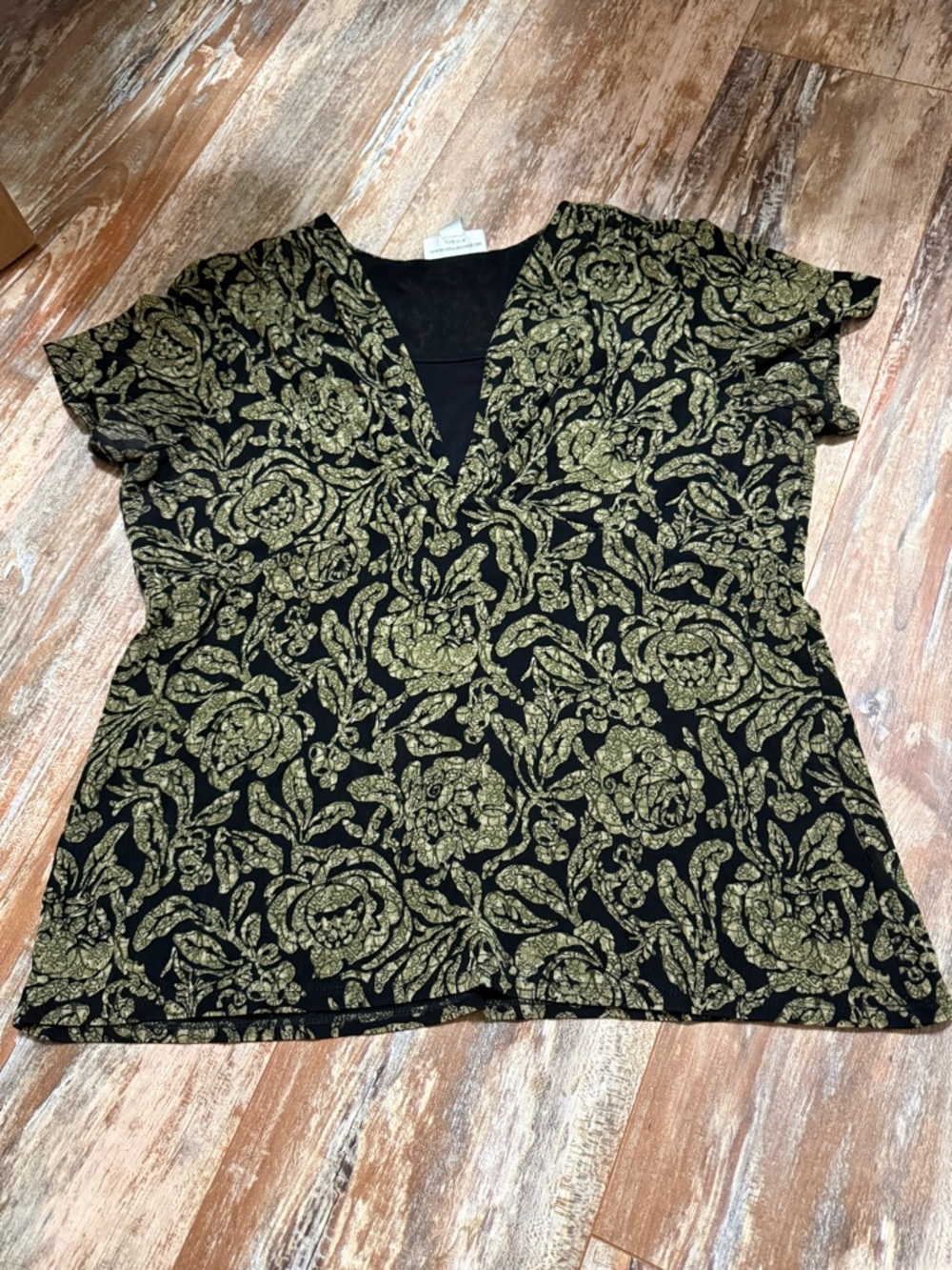 Coldwater Creek  Black Blouse with Gold  Print sz Large. Has a panel at V-neck
